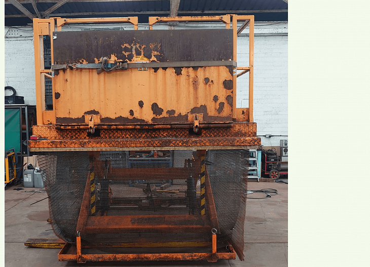 Refurb of orange scissor lift before