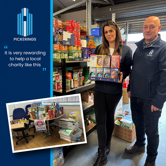 Rachel and Andrew donate supplies to the Food Bank